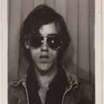 Self portrait in photo booth with aviators from The David Wojnarowicz Papers courtesy The Downtown Collection Fales Library and Special Collections, New York University.