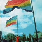The two original eight-color rainbow flags designed by Gilbert Baker flying at United Nations Plaza during San Francisco Gay Freedom Day 1978. Photograph by Mark Rennie, courtesy the Gilbert Baker Foundation.