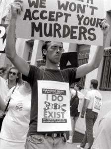 David Wojnarowicz demonstrates with ACT UP outside the offices of the NYC Commissioner of Health. Photograph copyright and courtesy t.l. litt.