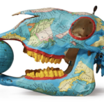 Untitled (Pig Skull), 1984. Acrylic and map collage on skull with metal globe, 7.5 by 11.5 by 5.5½ in.